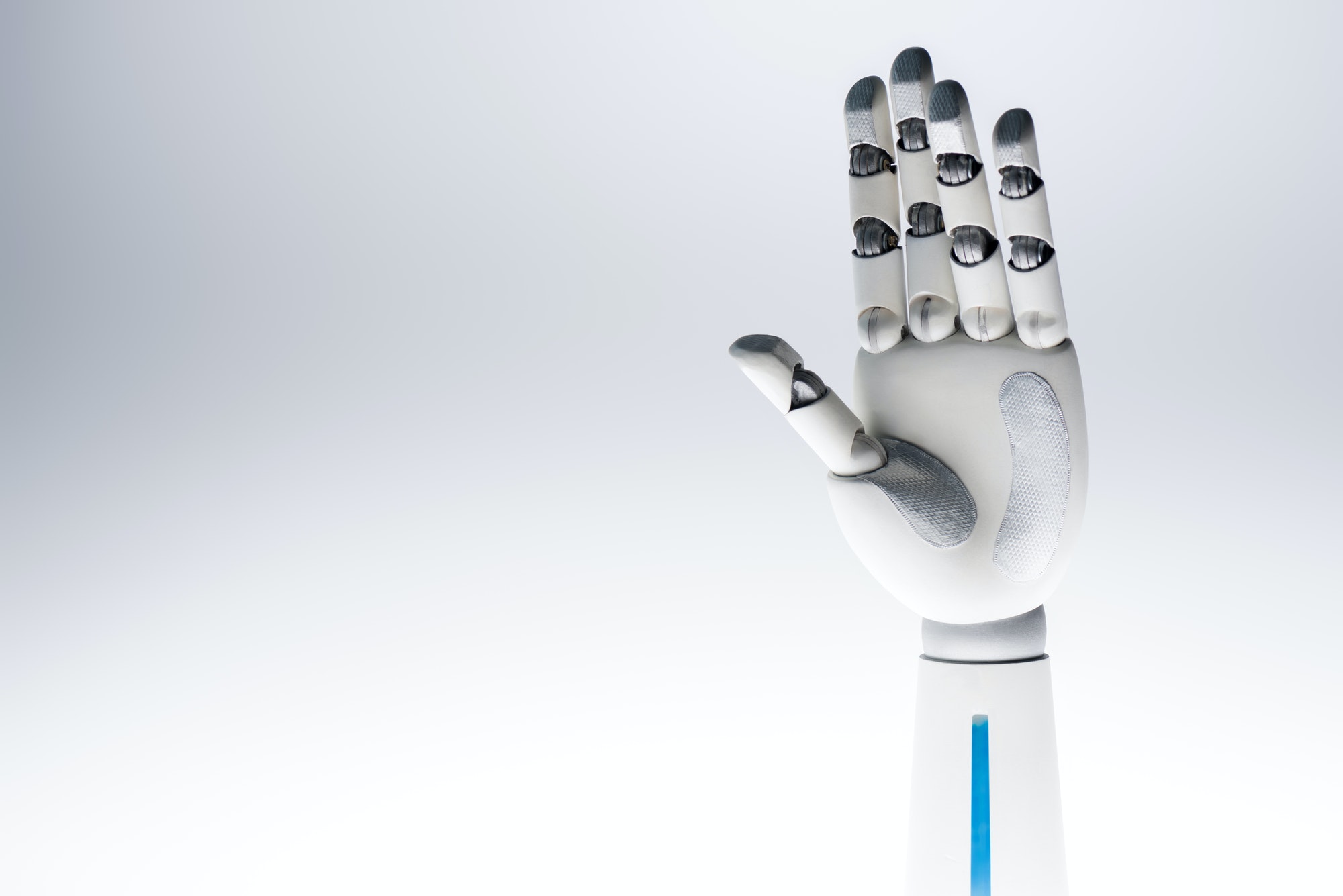 robot waving hand isolated on grey